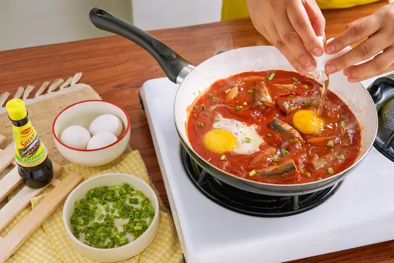 Cooking Ginisang Sardinas and Egg with MAGGI® Savor Calamansi