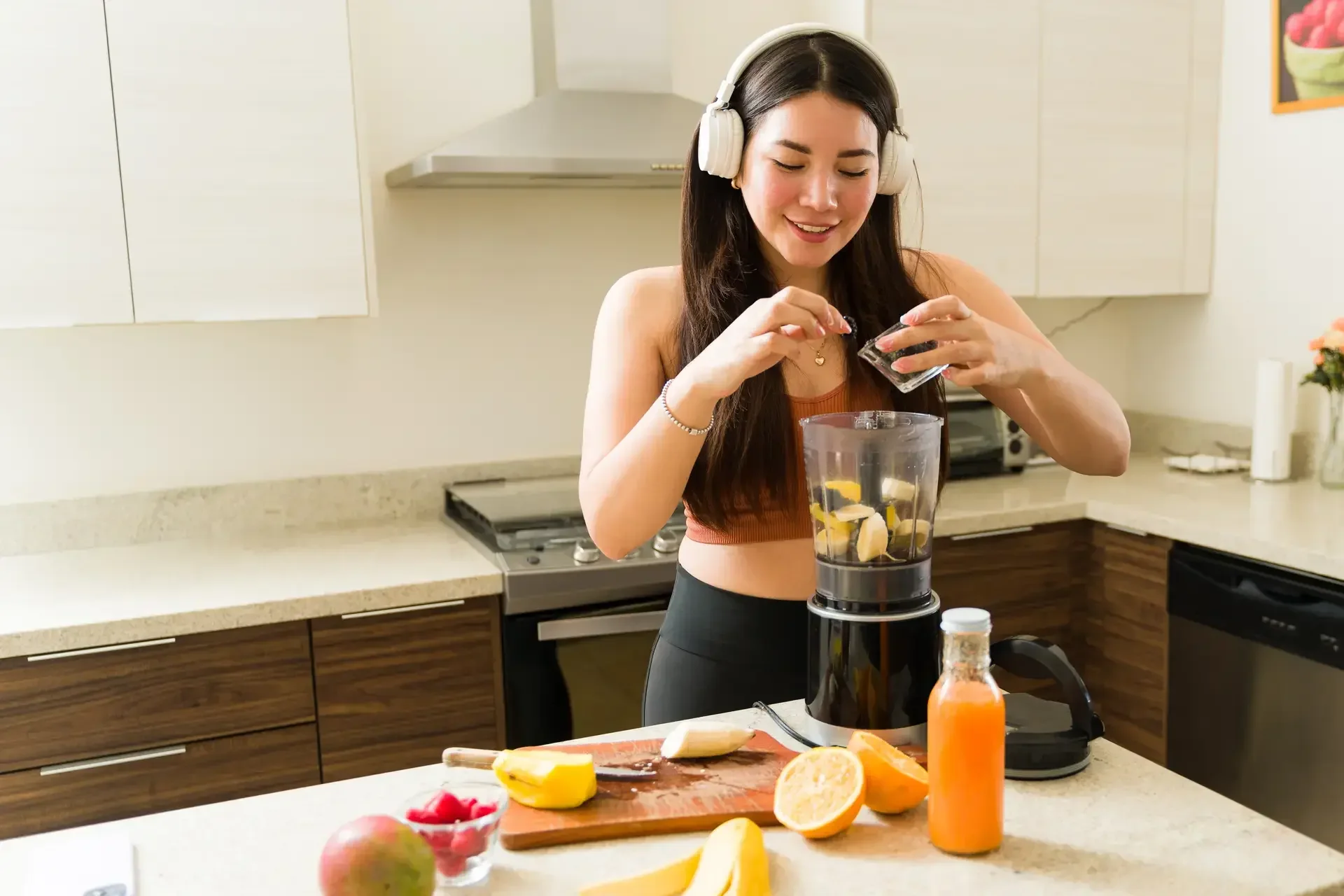 Woman preparing a smoothie