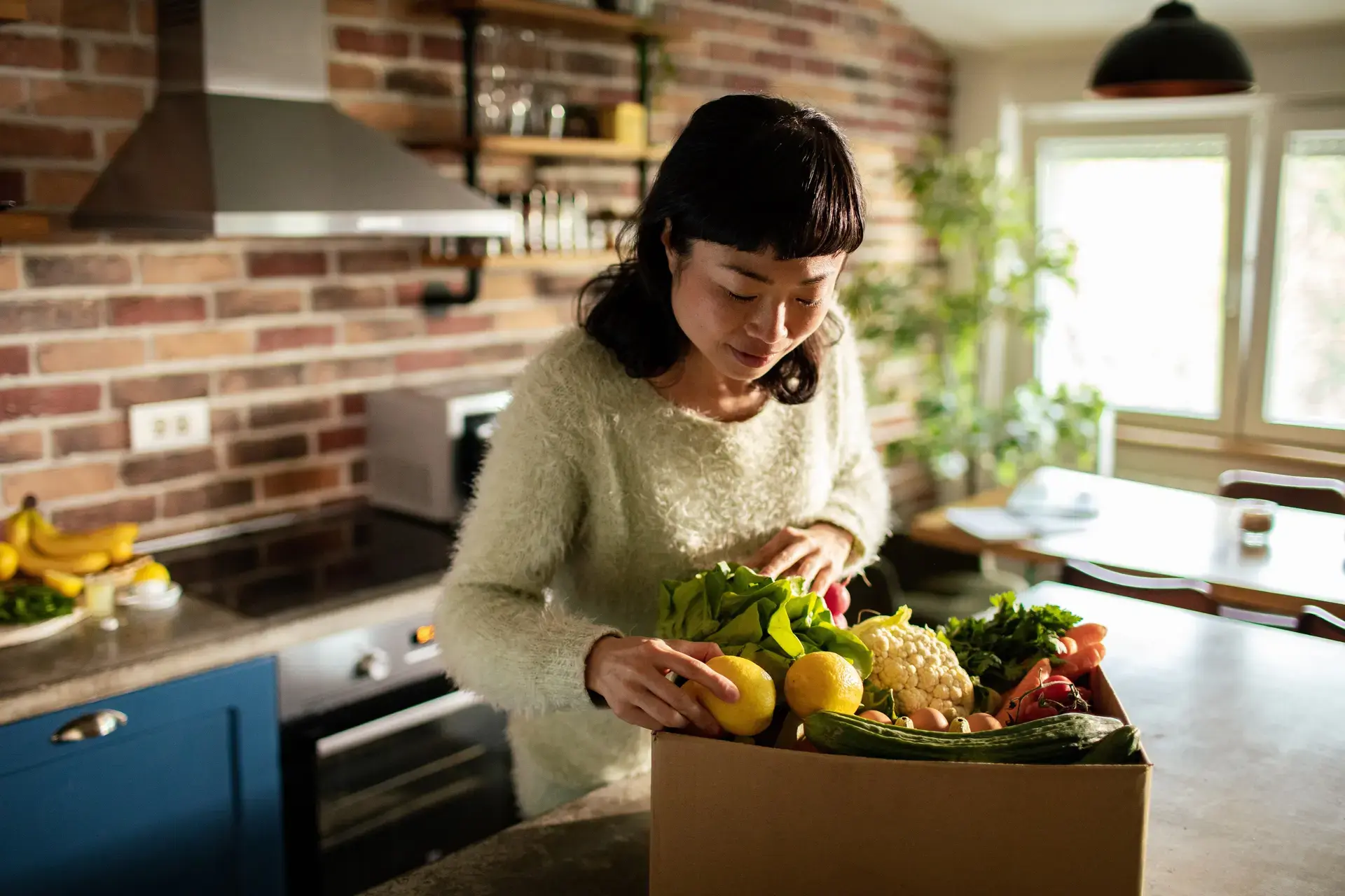 Woman taking out vegetables