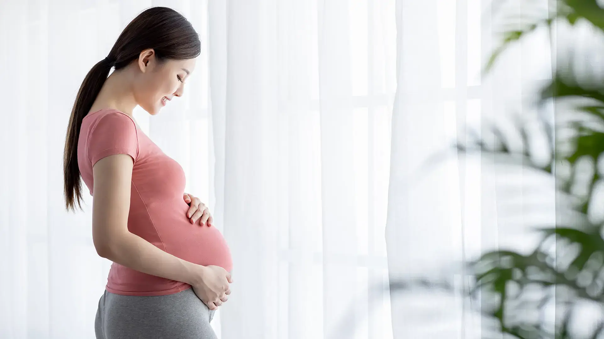 Side view of asian pregnant woman