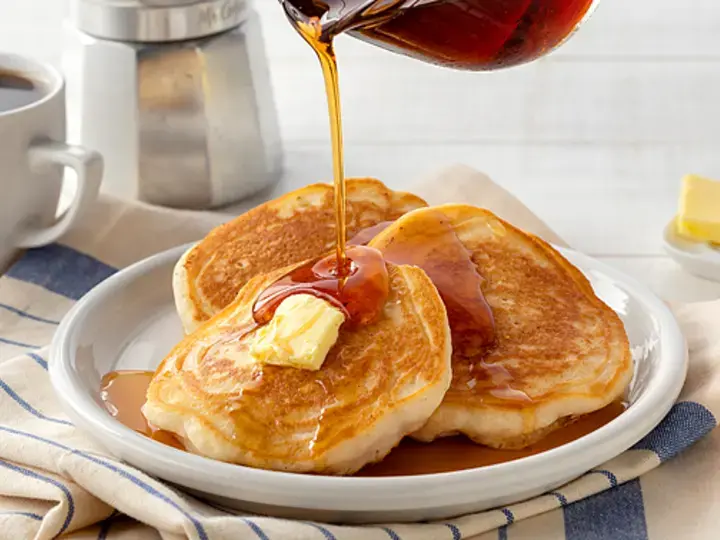 classic homemade pancake with syrup and butter